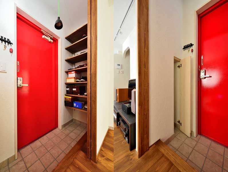 赤い扉が特徴的な玄関の様子